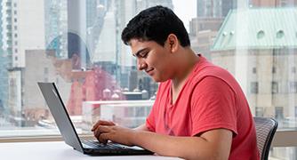 Image of students on a laptop